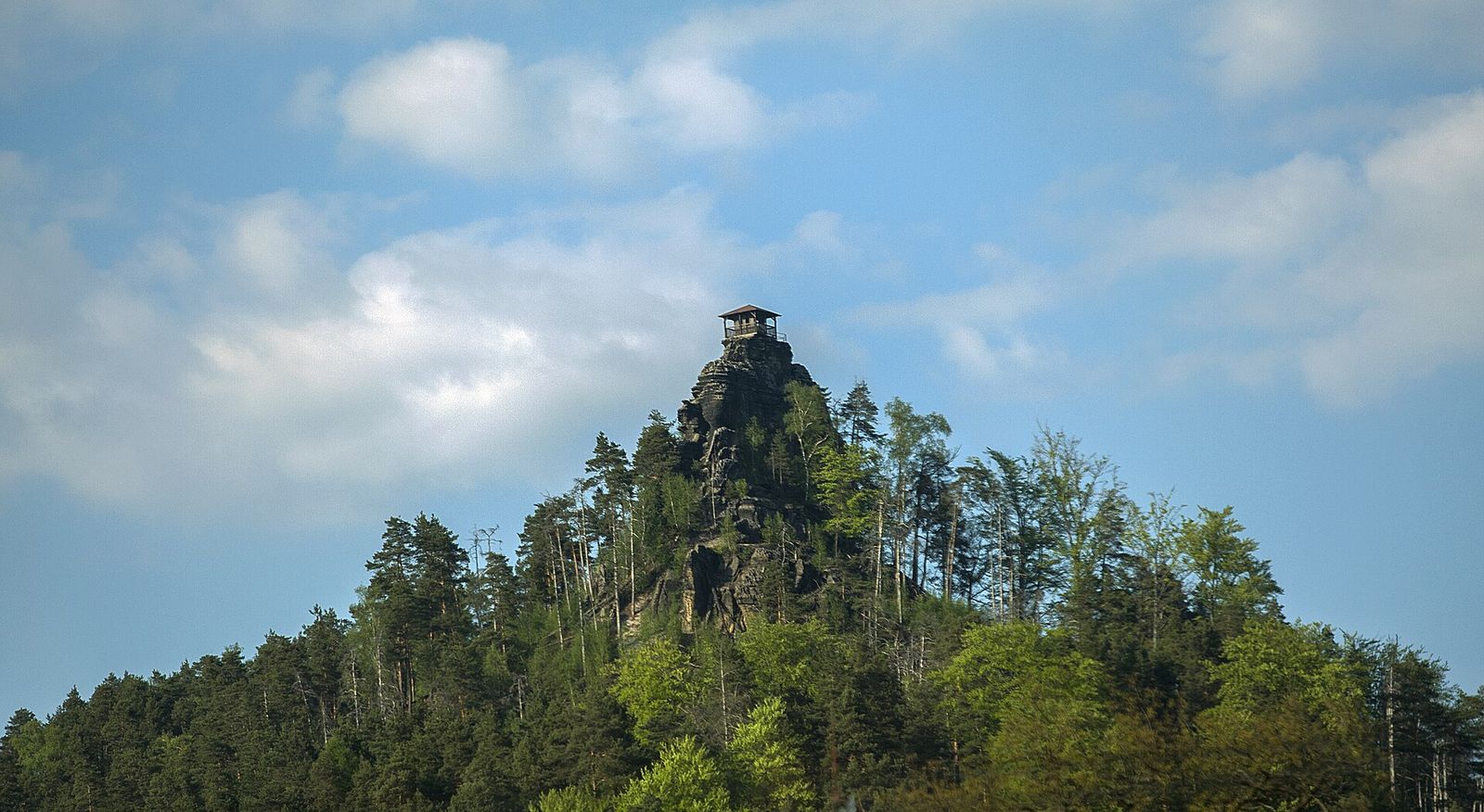 The wooden lookout hut of Mariina vyhlídka on top of a sandstone rock near Jetřichovice